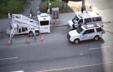 New York Police talking with vehicles around. 