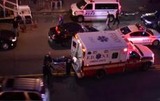 Person being administered emergency services in the street in NYC 